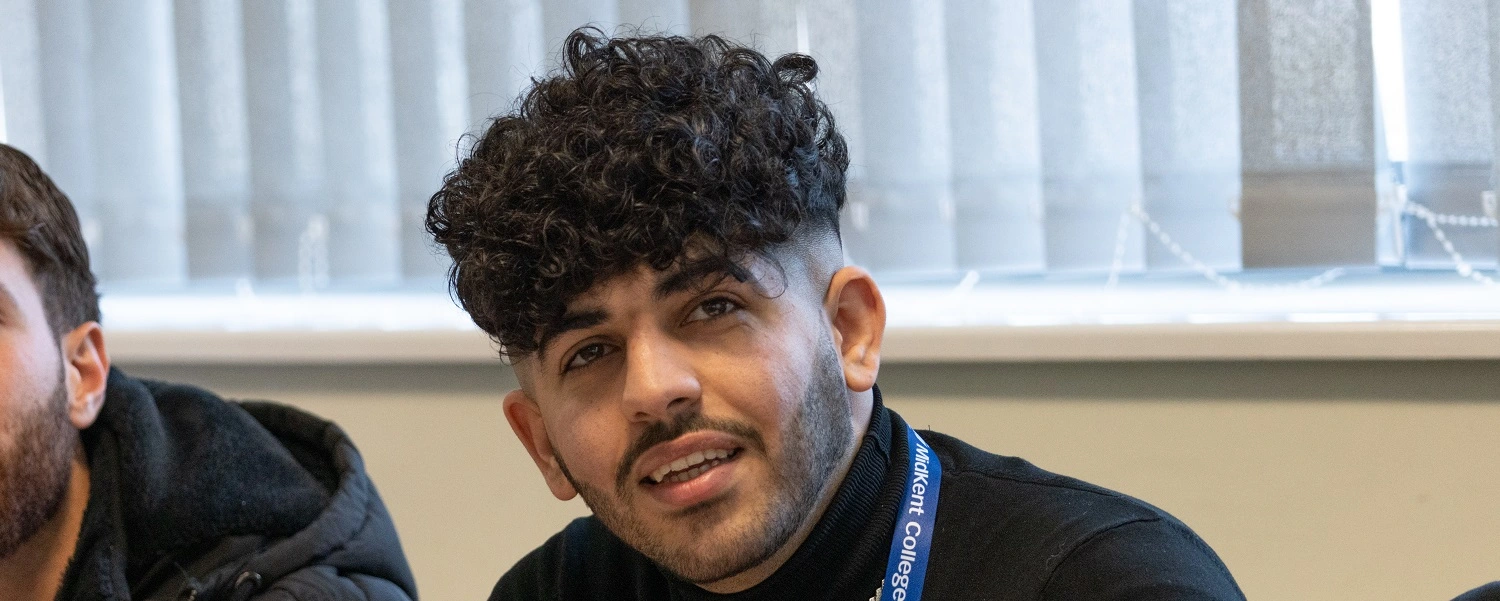 ESOL student smiles at the camera